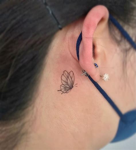 moon tattoo behind ear|small butterfly tattoo behind ear.